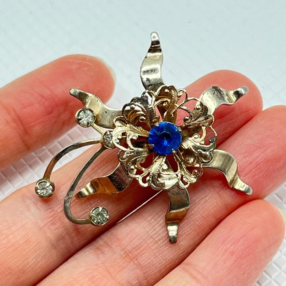 Vintage Gold Tone Flower Brooch w/ Blue and Clear Rhinestones